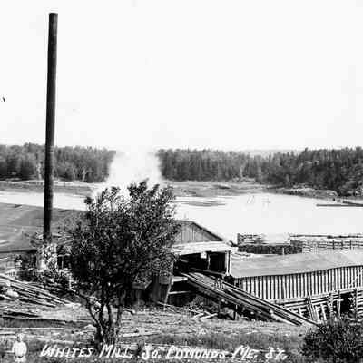 E.I. White's Steam Mill, with Hallowell's Island in the background, South Edmunds, Maine, c. 1905: Postcard view of E.I. Whites Steam Mill.  Note the small boy in the foreground.