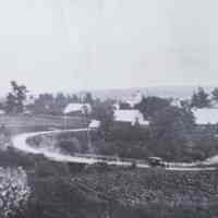         Panorama of Meddybemps Village, c. 1930; Detail of a panoramic view of the village of Meddybemps c. 1930.  Note the old touring car in the center of the picture.  The Harrison House is seen on the hill to the left.
   
