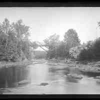          Falls Bridge over the Dennys River, c. 1885; Upstream view of the Falls Bridge over the Dennys River, with Dennysville on the right and Edmunds on the left.  Photograph by John P. Sheahan of Edmunds, taken during the late 1880's.
   