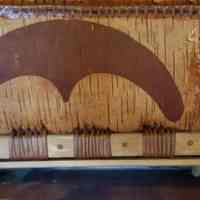          Traditional design on Passamaquoddy Canoe; Detail of the gunwale and patters inscribed on the mid section of a birchbark canoe at the Wabanaki Museum in Indian Township, Maine.
   