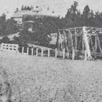          Old and new bridges over Hobart Stream in 1927; Richard Hobart, Sr.'s house was under construction on the hill when this photograph was taken following the construction of new cement bridge in 1926, to replace the old iron one beside it.
   