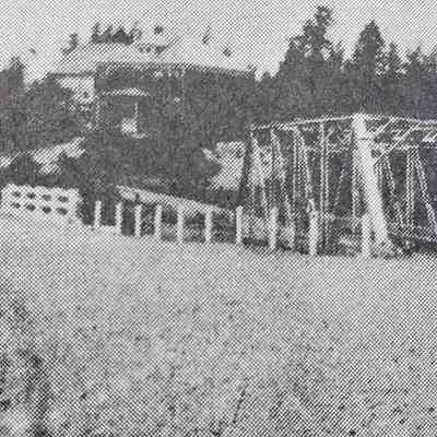 Old and new bridges over Hobart Stream in 1927: Richard Hobart, Sr.'s house was under construction on the hill when this photograph was taken following the construction of new cement bridge in 1926, to replace the old iron one beside it.