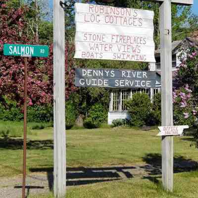 Signage for Robinson's Cottages and Dennys River Guide Service on Route 86 in Edmunds, Maine