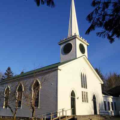 Dennysville-Edmunds Congregational Church, March 26, 2017: Sunlight guilds the Dennysville Edmunds Congregational Meetinghouse on the morning of March 26, 2017.  The Parish Hall was built by the Church in gratitude for the 200th anniversary of its founding in 2005.
