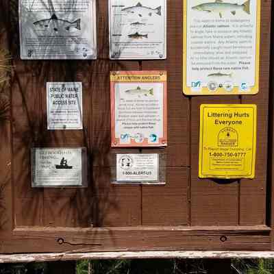 Signage beside the salmon weir located on the Dennys river, Dennysville, Maine