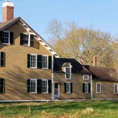 Mill House, Dennysville, Maine: Side view of the Mill House with ell and woodshed attached on the back.