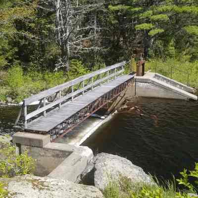 Great Works Dam: A cement dam stands where T.W. Allan's "Great Works" mill sawed out long lumber, shingles and lath through much of the 19th century.  After the Washington County Railroad opened in 1898, a nearby siding carried pulpwood and other products to market.