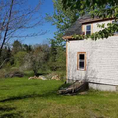Carl and Eliza Lyons House, Crossroad, Dennysville, Maine: Carl and Eliza Lyons house with a view across the field to Wilson's Stream.