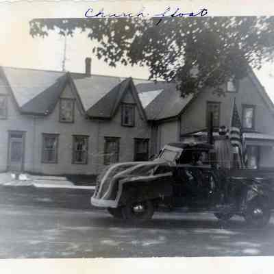 A Fourth of July Parade float passes the Cyrus Kilby House, on the Lane in Dennysville, Maine.