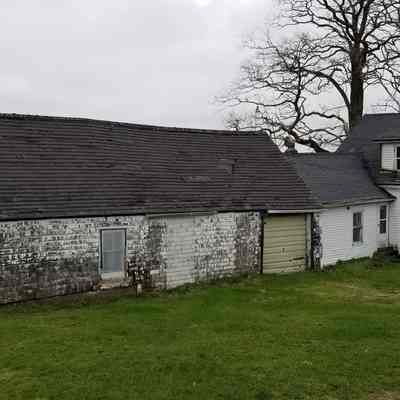 Rear view of the Prouty house with ell and barn: Photo taken from the hill where the earlier hen houses stood.