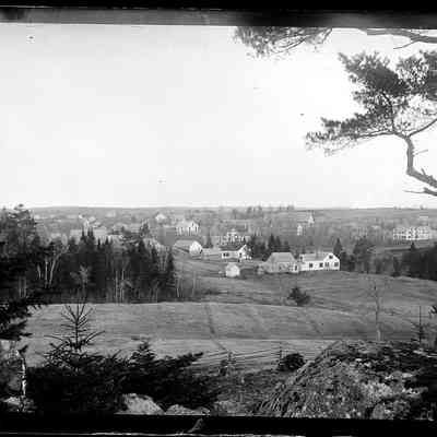 View from the Isaac and Joanna Hobart gravesite in Edmunds, Maine: The communities of Edmunds and Dennysville are seen together from the hilltop cemetery in this photograph taken by Dr John P. Sheahan of Edmunds, whose white house and barn are clearly recognizable in the foreground, in this photograph taken around 1885.