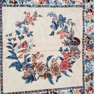 embroidered initials, possibly SB