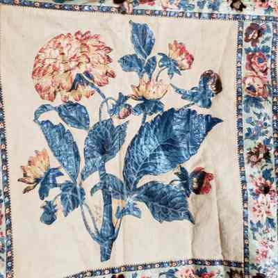 embroidered initials, possibly TLG